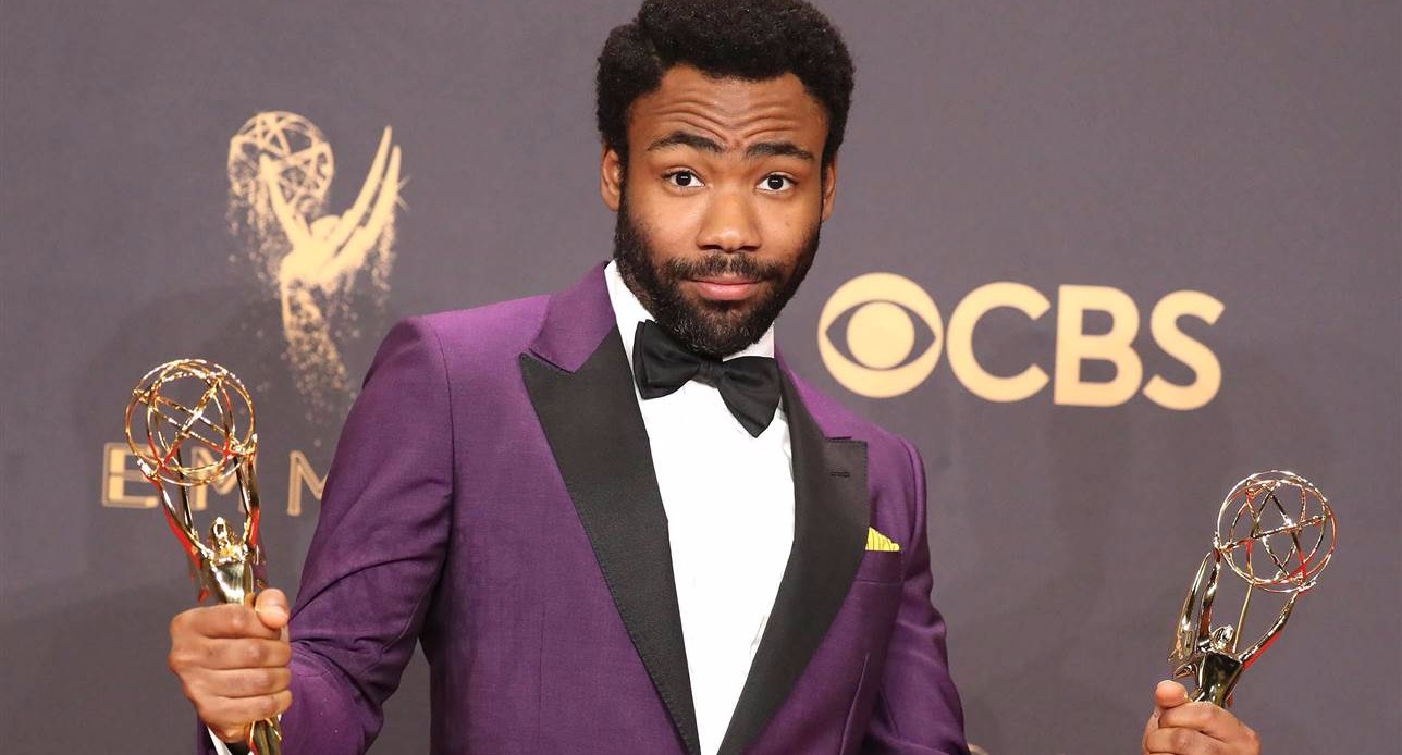 Donald Glover poses with his Emmy awards for lead actor in a comedy series and comedy series director for his work in "Atlanta." Photo credit: Lucy Nicholson / Reuters